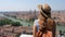 Rear view of tourist girl on viewpoint in Verona, Italy. Slow motion.