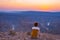 Rear view of tourist looking at expansive view over the Fish River Canyon, scenic travel destination in Southern Namibia. Ultra wi