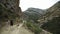 Rear view tourist two women and one man are walking in the mountains cute summer enjoying European holiday travel