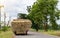 Rear view truck straw bales on rural roads