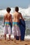 Rear view two boys standing on the beach
