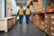 Rear view of two male workers analysing the stock in manufacturing industry