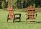 Rear view of two wooden painted adirondack chairs