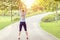 Rear view of woman jogging in empty park due to social distancing measures