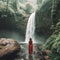 Rear view of woman looking at tropical waterfall Generative AI