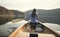 Rear view of woman paddling canoe on lake