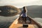 Rear view of woman paddling canoe on lake