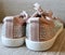 Rear view of womens pink sequin trainers sparkling in light