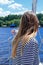 Rear view of a young woman enjoying sailing on a yacht