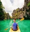 Rear view of young woman in kayak in El Nido, Palawan, Philippines