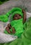 Reborn baby doll, in green dress