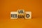 Rebuild and Rebrand symbol. Turned wooden cubes with words Rebrand and Rebuild. Beautiful orange background. Rebuild Rebrand and