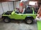 Rebuilding and Repainting Green All Terrain Vehicle in Garage