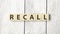 Recall written on cubes on wooden background