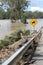 Receding Flood with Flood Debris on road on Brisbane River near Colleges Crossing 1st March 2022