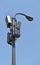 Receivers and transmitters on a pole blue sky background