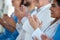 Receiving some enlightening information. a team of medical staff applauding during a conference.