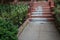 Recently repaired concrete stairs to old brownstone, simple railing