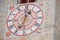 The recently restored clock and  sundial painted outside the bell tower of the church of the town