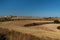 Recently sown fields with semi-destroyed sheepfolds and the peak of Moncayo in the background