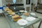 Reception with sandwiches, cakes, breads, snacks, pies and napkins on a glass table