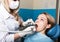 The reception was at the female dentist. Doctor examines the oral cavity on tooth decay. Caries protection. doctor puts