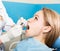 The reception was at the female dentist. Doctor examines the oral cavity on tooth decay. Caries protection. Tooth decay