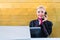 Receptionist with phone on front desk in Hotel