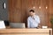 Receptionist talking on phone at desk