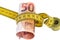 Recession concept with a fifty euro banknote surrounded by a flexible tape measure on a white background