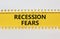 Recession fears symbol. Concept words Recession fears on yellow paper on a beautiful white background. Business and recession