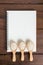 Recipe notebook, rice in wooden spoon on wooden background