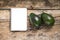Recipe Notepad with two avocado on wood background