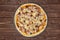 Recipe of pizza capriciosa on brown wood