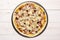 Recipe of pizza capriciosa on grey wood
