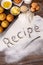 Recipe word with cakes and baking ingredients, vertical