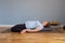 Reclining Hero Pose or Supta Virasana. Pregnant woman resting in yoga asana