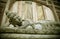 Reclining and sleeping Buddha Balinese religious statue in Ubud in the Island of Bali , Indonesia at the gate of temple in Buddhis