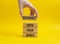 Reconnect with your Goals symbol. Wooden blocks with words Reconnect with your goals. Beautiful yellow background. Businessman