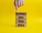 Reconnect with your Goals symbol. Wooden blocks with words Reconnect with your goals. Beautiful yellow background. Businessman