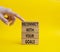 Reconnect with your Goals symbol. Wooden blocks with words Reconnect with your goals. Beautiful yellow background. Businessman