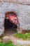 Reconstructed hut from prehistoric era with a animal skin in the door opening