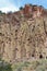 Reconstructed pueblo on cliffs at Bandelier National Monument, New Mexico