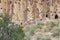 Reconstructed pueblo on cliffs at Bandelier National Monument, New Mexico