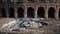 Reconstruction ancient ruined of Roman Colosseum amphitheater on sunny day. Concept of restoration and reconstruction of
