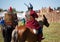 Reconstruction. Country. Medieval knight whith lance on horse from fantasy. Equestrian soldiers in historical costumes