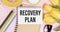 Recovery plan inscription, calculator, pen