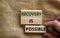 Recovery is possible symbol. Wooden blocks with words `Recovery is possible`. Beautiful canvas background, male hand. Copy space