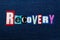 RECOVERY text word collage, colorful fabric on blue denim, abuse and treatment concept