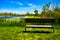 Recreational Bench Rest Stop Overlooking Distant Blue Lake